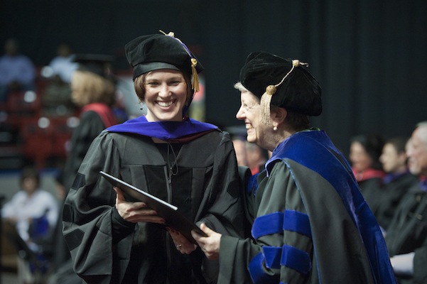Dean Emily Spieler (right) congratulated each graduate.
