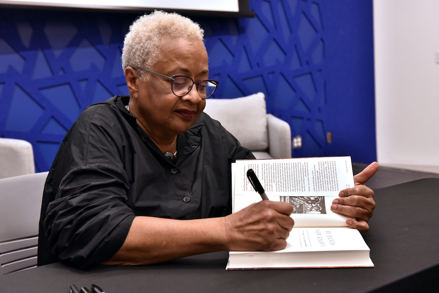 Professor Margaret Burnham signs copies of her new book, <i>By Hands Now Known: Jim Crow’s Legal Executioners.</i>