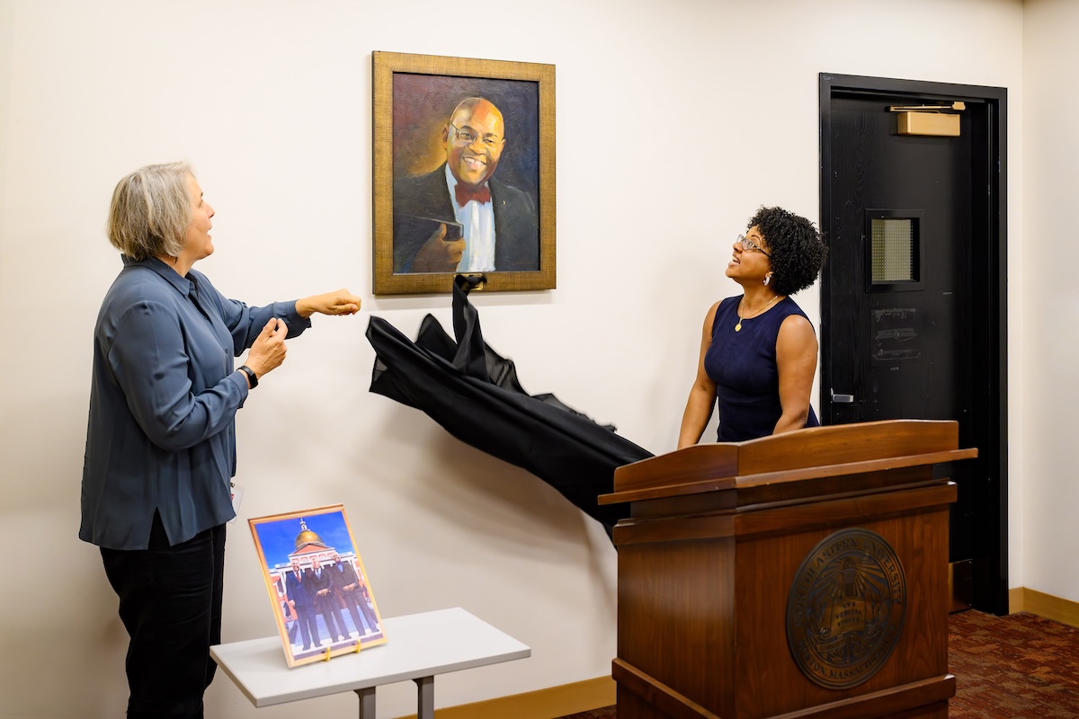Artist Sharman Altshuler (left) and Stacy Cowan ’97 unveil the painting 